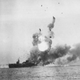 The USS St. Lo (CVE-63) explodes following a kamikaze attack during the Battle of Leyte Gulf